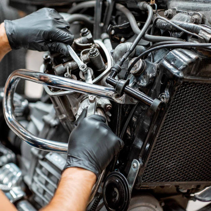 Mechanic Wearing GP Craft 5.5 MIL Black Nitrile Exam Gloves