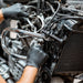 Mechanic Wearing GP Craft 5.5 MIL Black Nitrile Exam Gloves