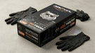 Box of black gloves with 'Growl' branding on a gray surface