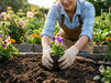 Girl Wearing Tuff Gard Cotton/Polyester Knit Glove while planting flowers in a garden
