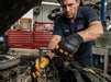 Mechanic working on a car engine in a garage wearing Tuff Gard Deerskin Mechanic Glove 