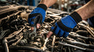 Person working on a car engine with tools and wearing Tuff Gard Synthetic Leather Fingertip Mechanic Glove