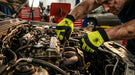 Mechanic working on a car engine with tools in a garage setting-wearing Full‑Finger Mechanic Glove