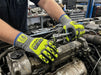 Mechanic working on a car engine in a garage wearing Tuff Gard Cut Resistant Nitrile‑Palm Coated Glove