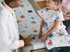 TIDI- CHOICE EXAM GOWNS- PEDIATRIC GOWN, TISSUE/POLY/TISSUE, FRONT OR BACK OPENING- 21" X 36" Tidi Schooltime 